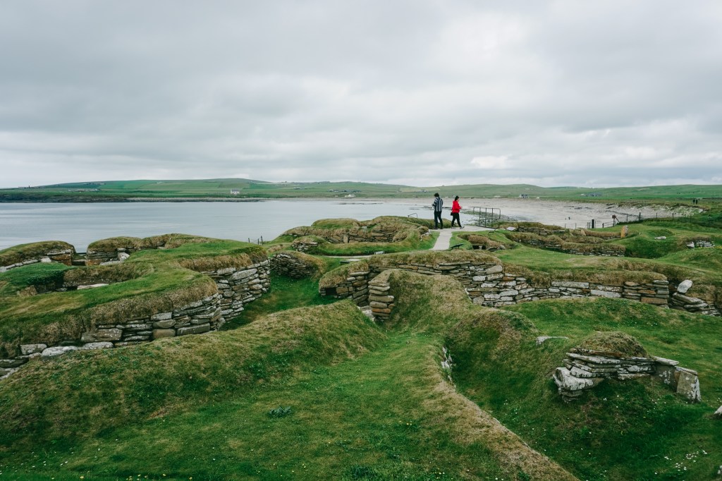 Neolithic village ruins with stones built in circles that would have once been rooms that people lived in