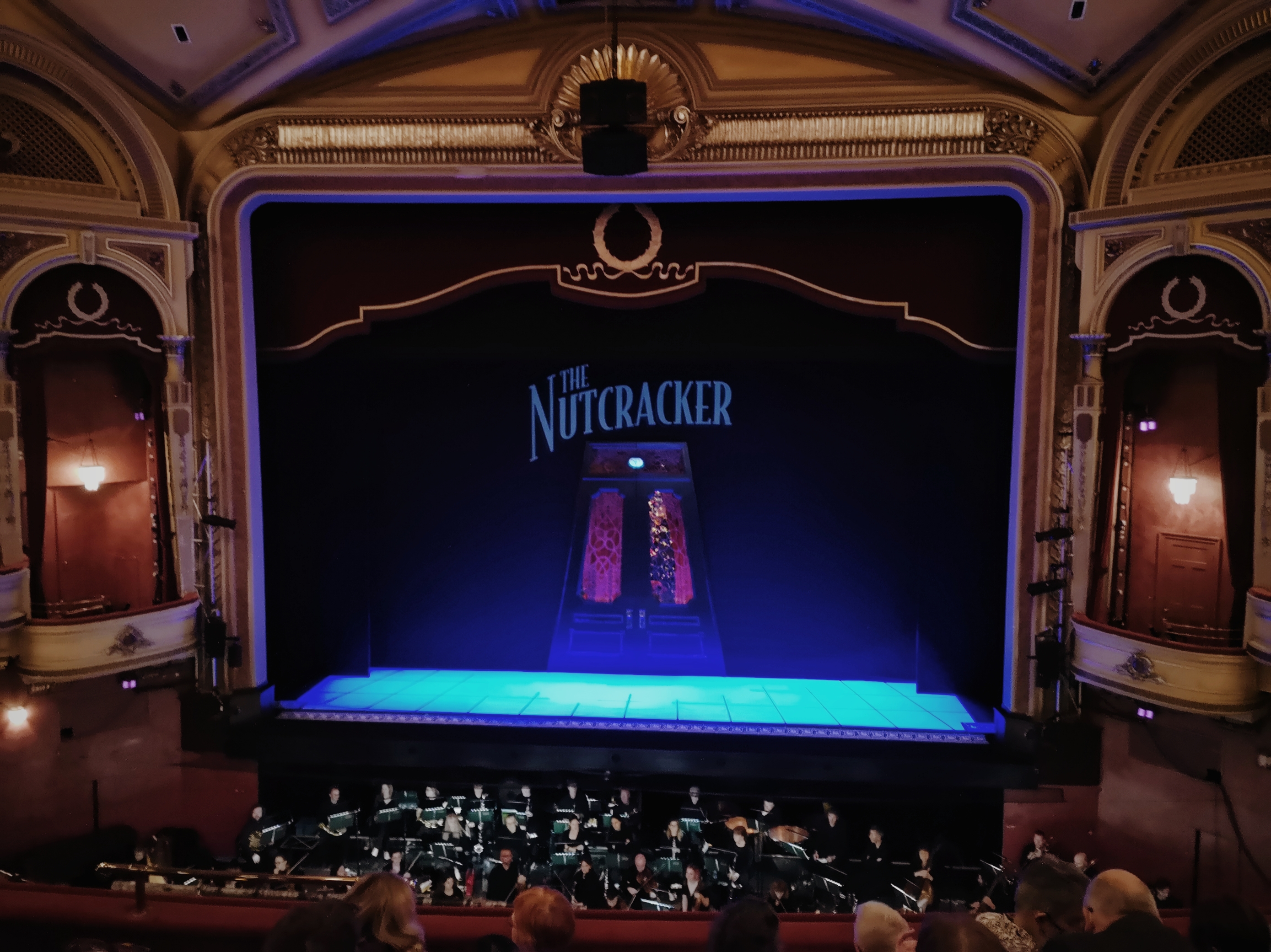 A theatre with The Nutcracker on stage and the orchestra in the pit below