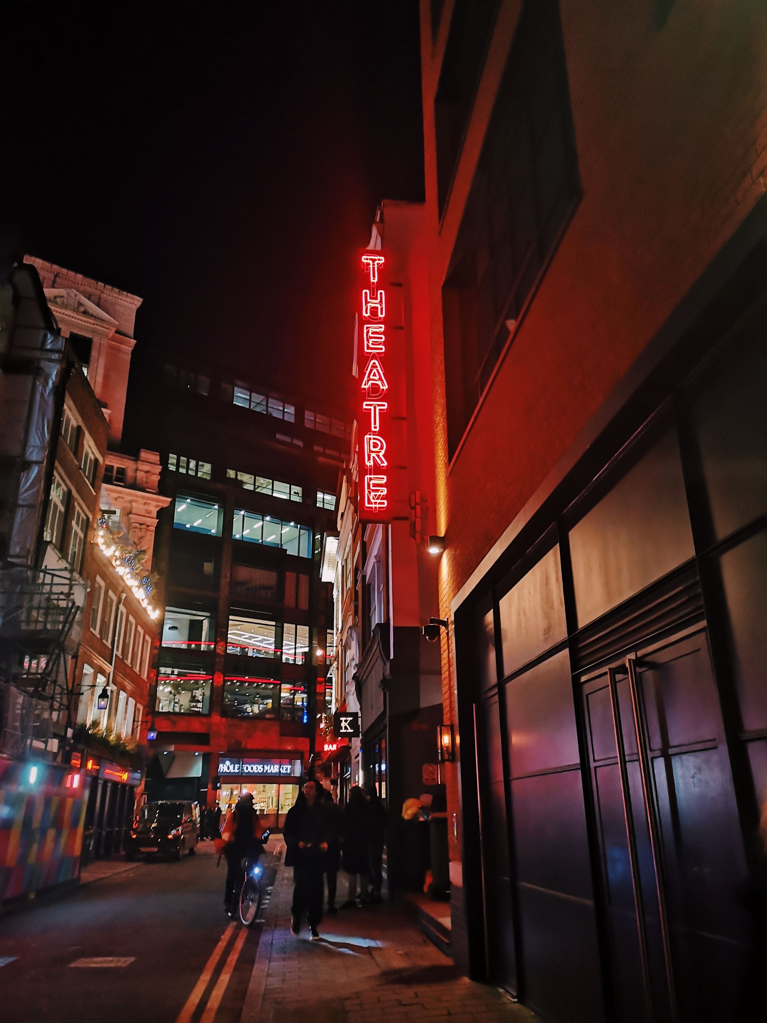 A red neon light read THEATRE