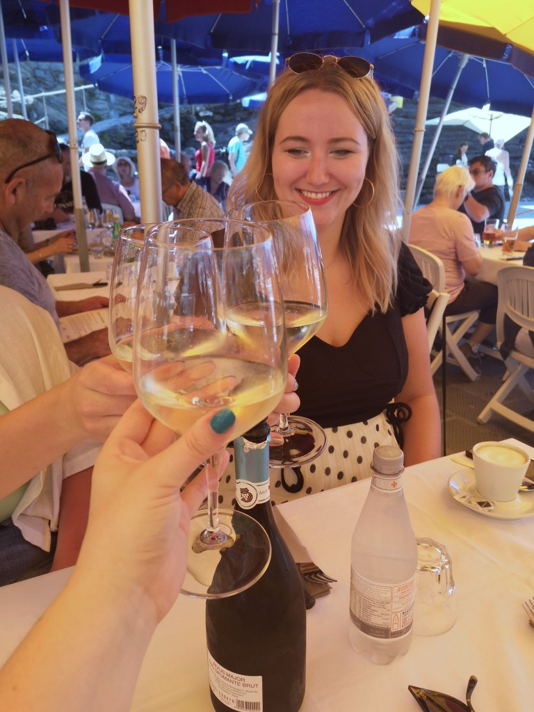 Hanna smiles as we cheers our glasses of prosecco