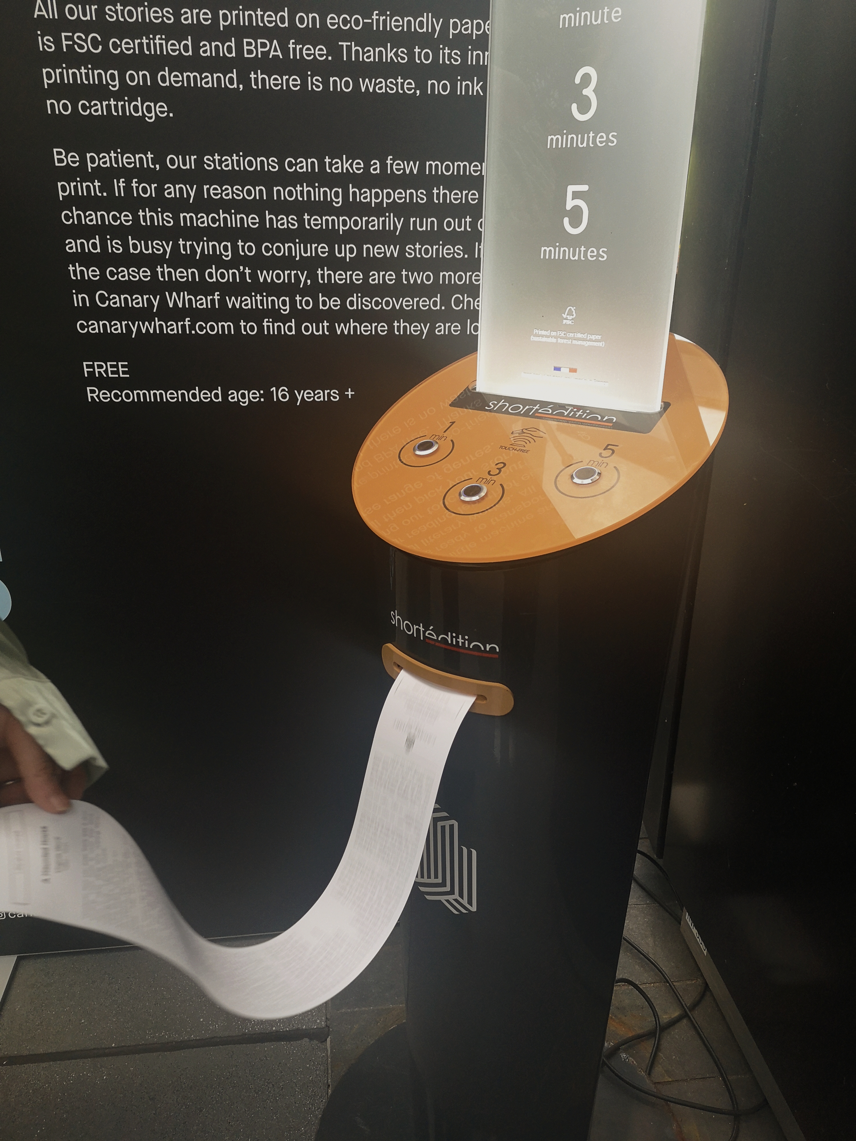 A big long 5-minute story is printing out of the short story dispenser