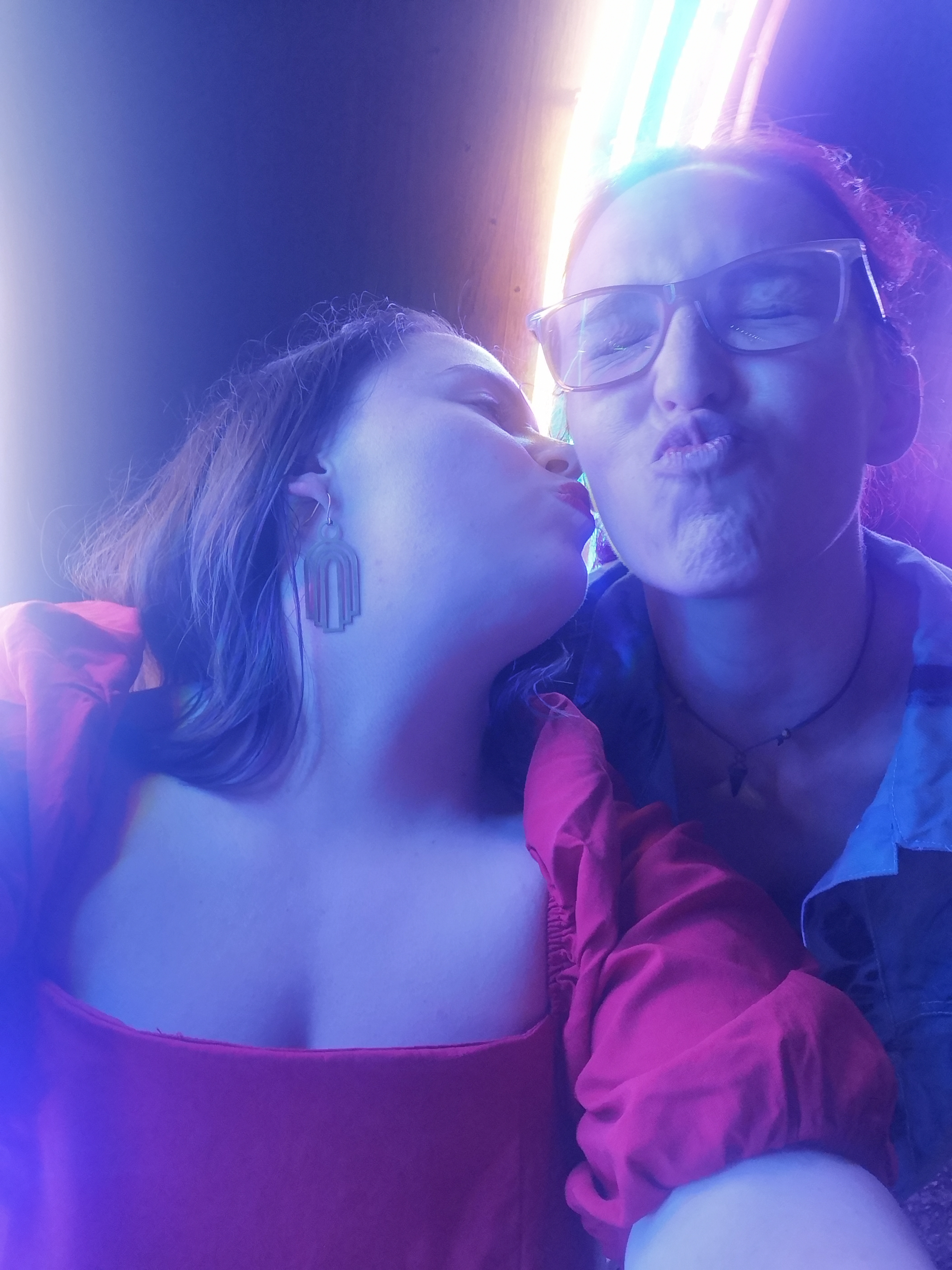 I kiss the cheek of my friend Deby who makes a kissy shape with her mouth