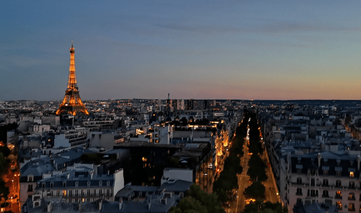 An image of Paris and the Eiffel Tower taken from the Arc de Triomphe
