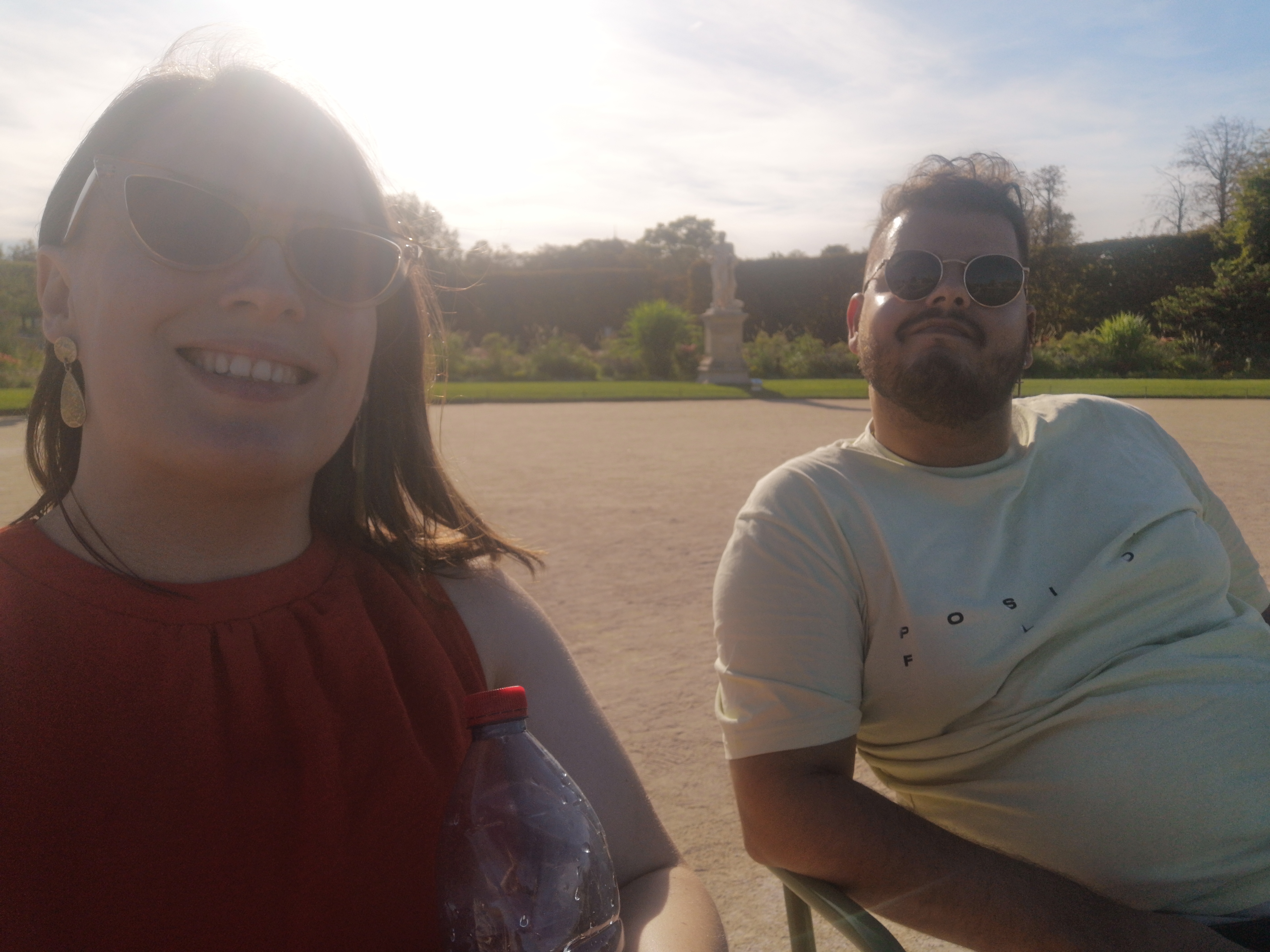 Me and Bruno smile with our sunglasses on, feeling cosy and content before starting the (delayed) journey home