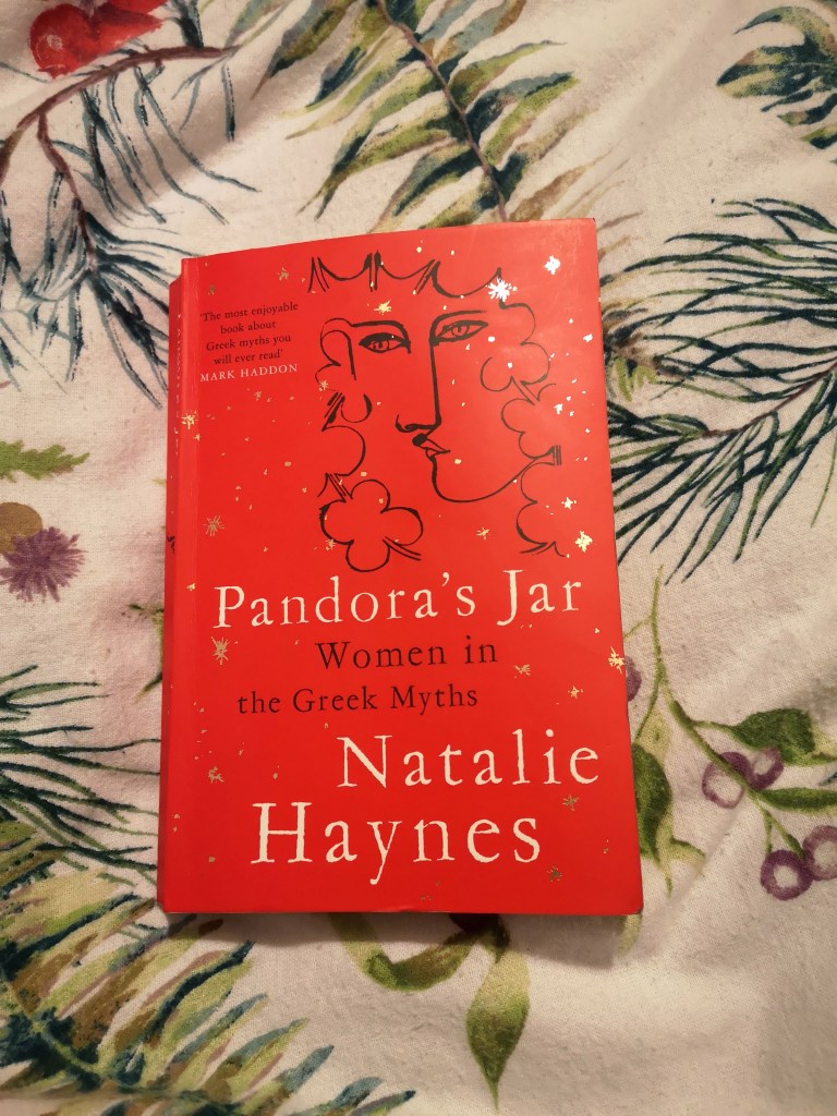 A copy of Pandora's Jar which has the line drawing of a woman's face and some clouds