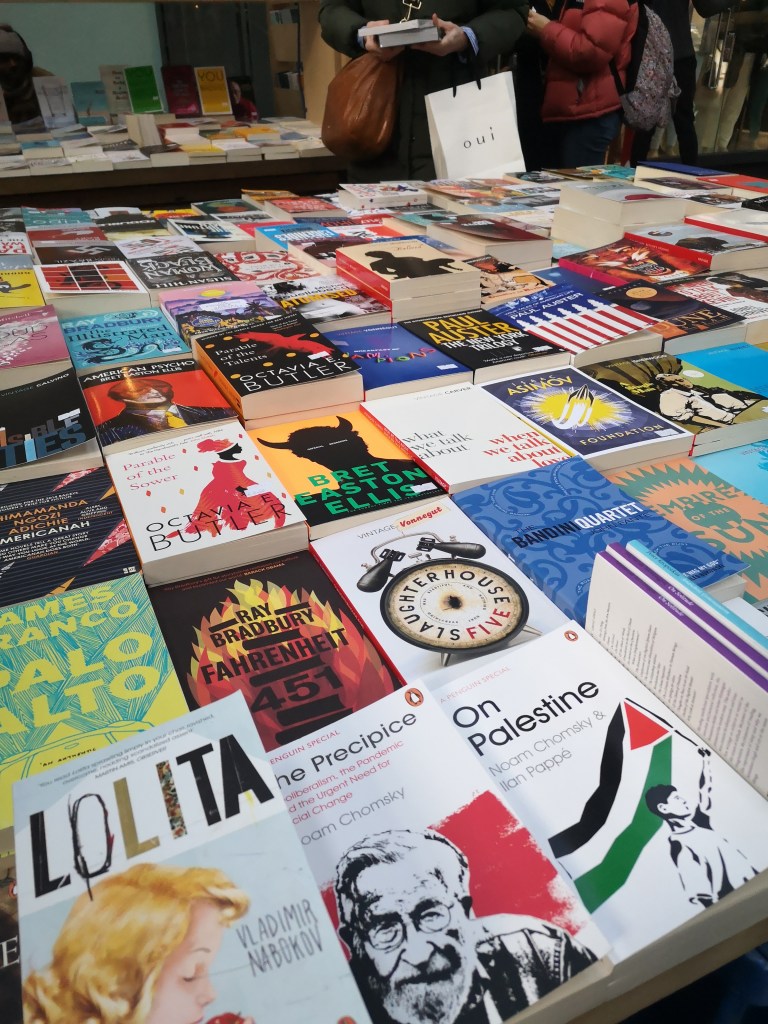 a market table covered in books
