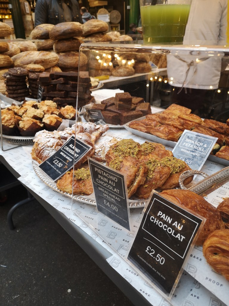 Delicious looking pastries stacked in a glass case