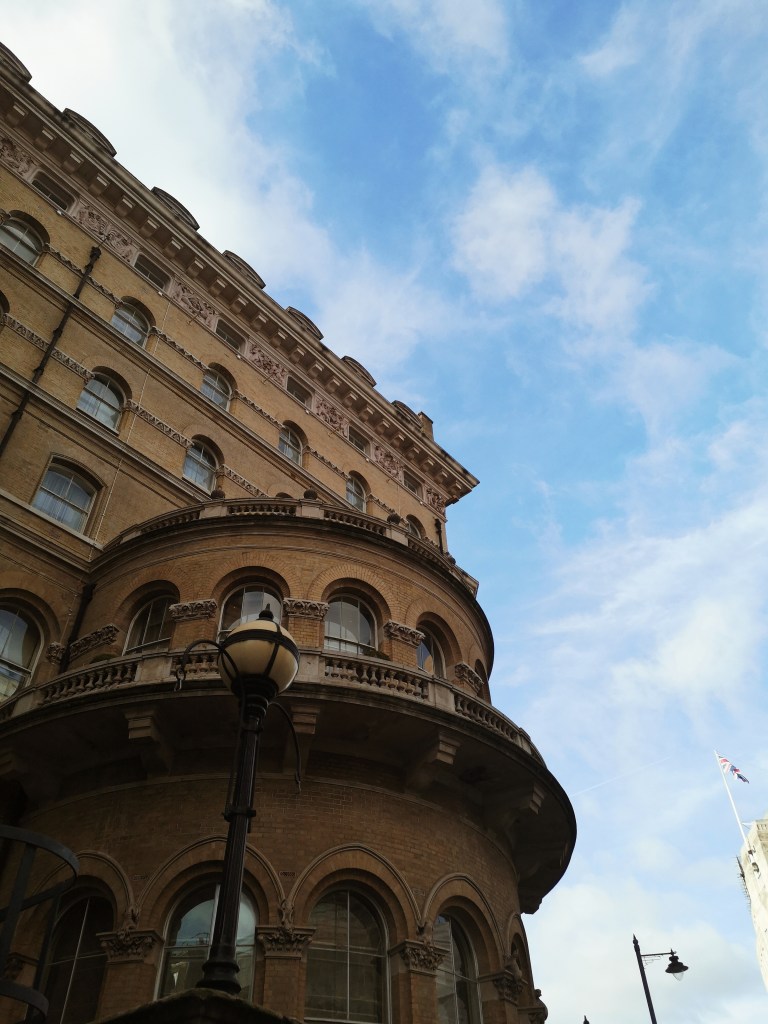 A round stone building against a blue sky