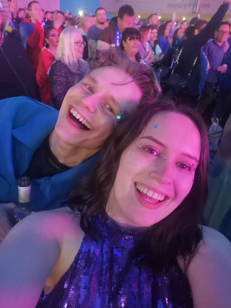 Two drunk looking babies smiling in the joy of Eurovision