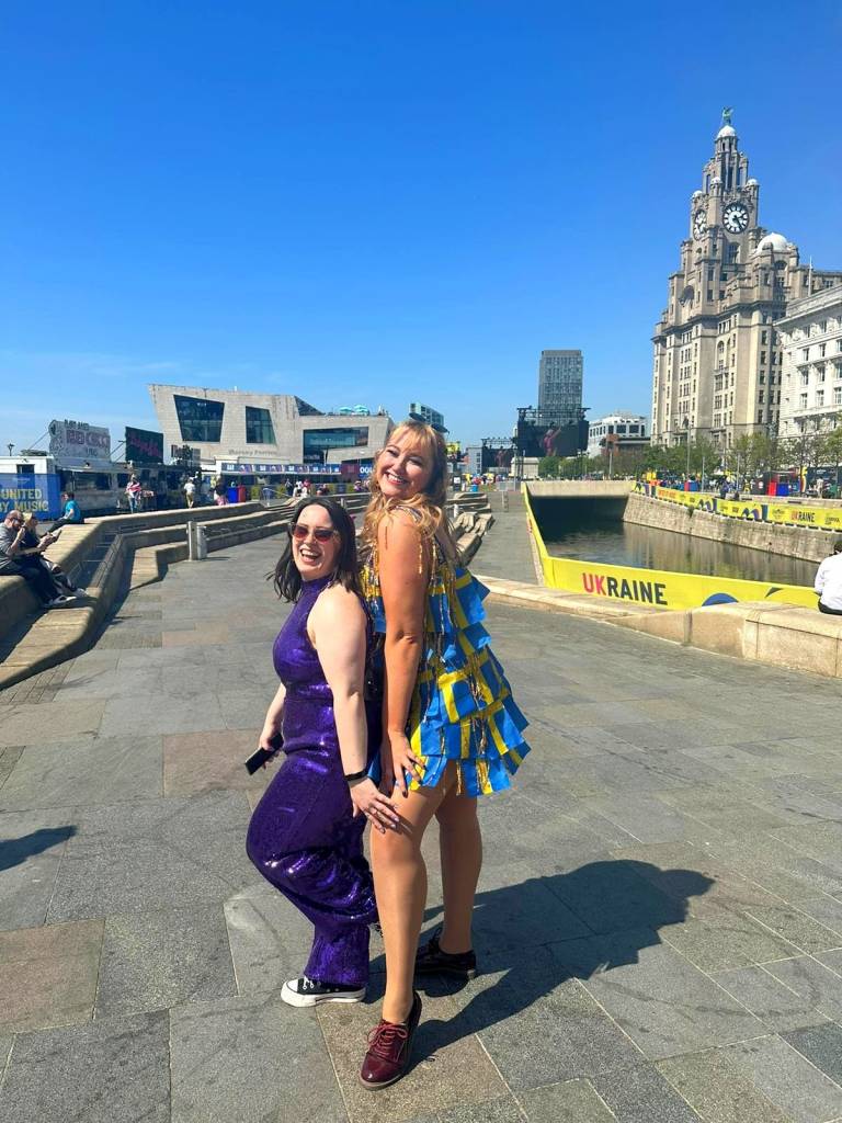 I pose in my sequins beside Hanna in her dress made out of little Swedish flags