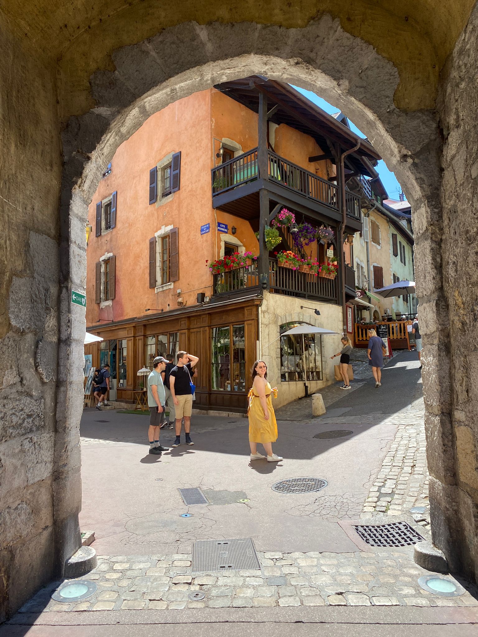 I look over my shoulder standing on the other side of a stone arch