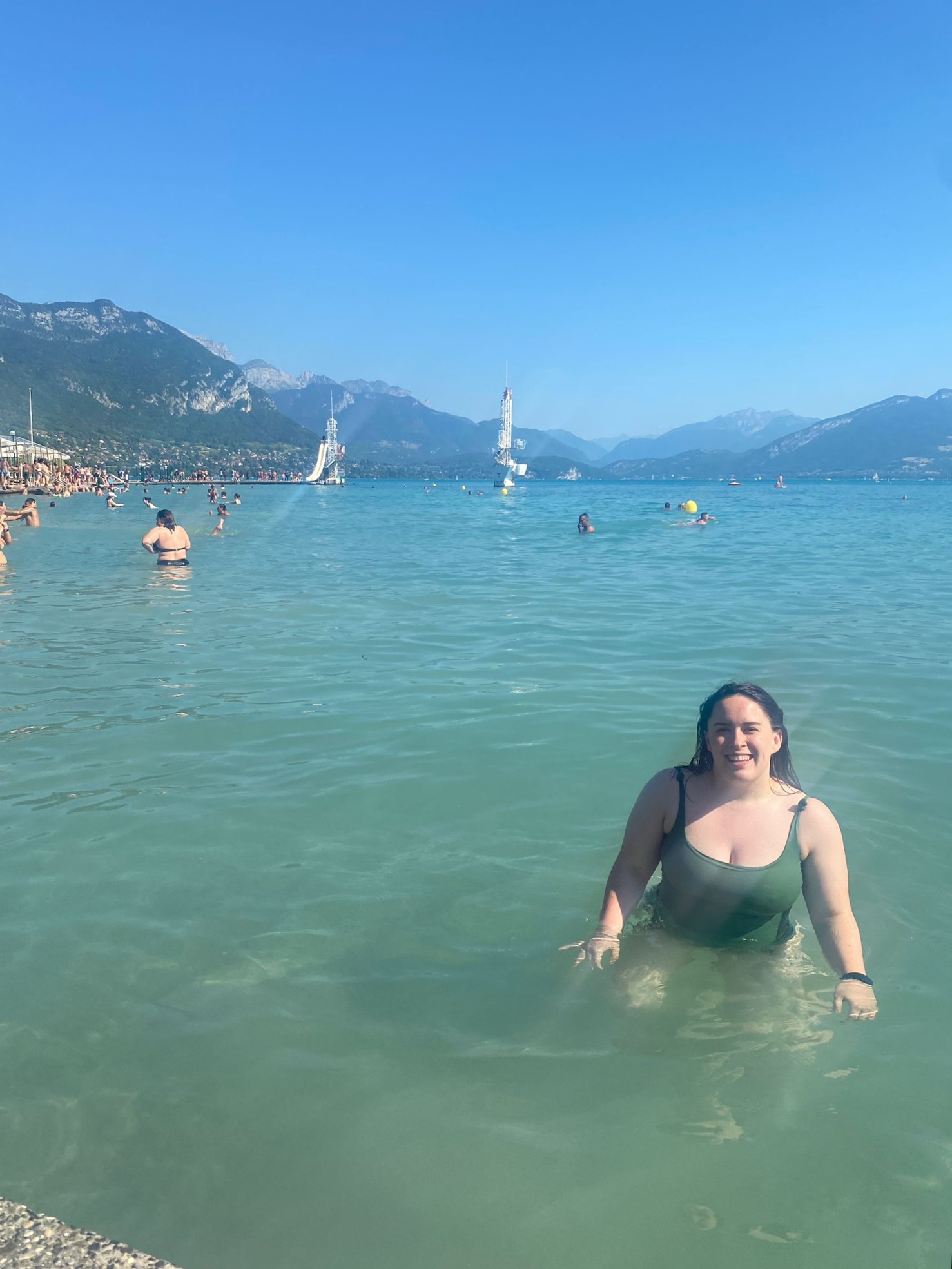 I stand in the lake smiling