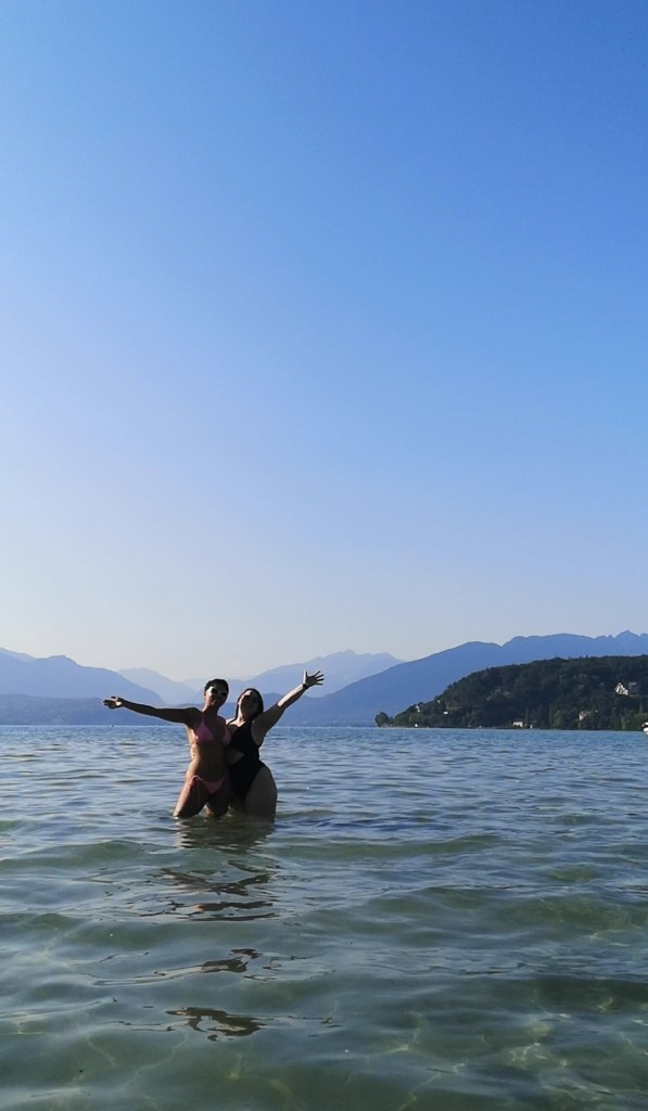 Danielle and I stand in the lake with our arms outstretched