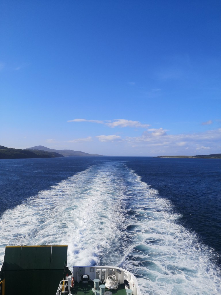 A white trail of water out the back of the ferry