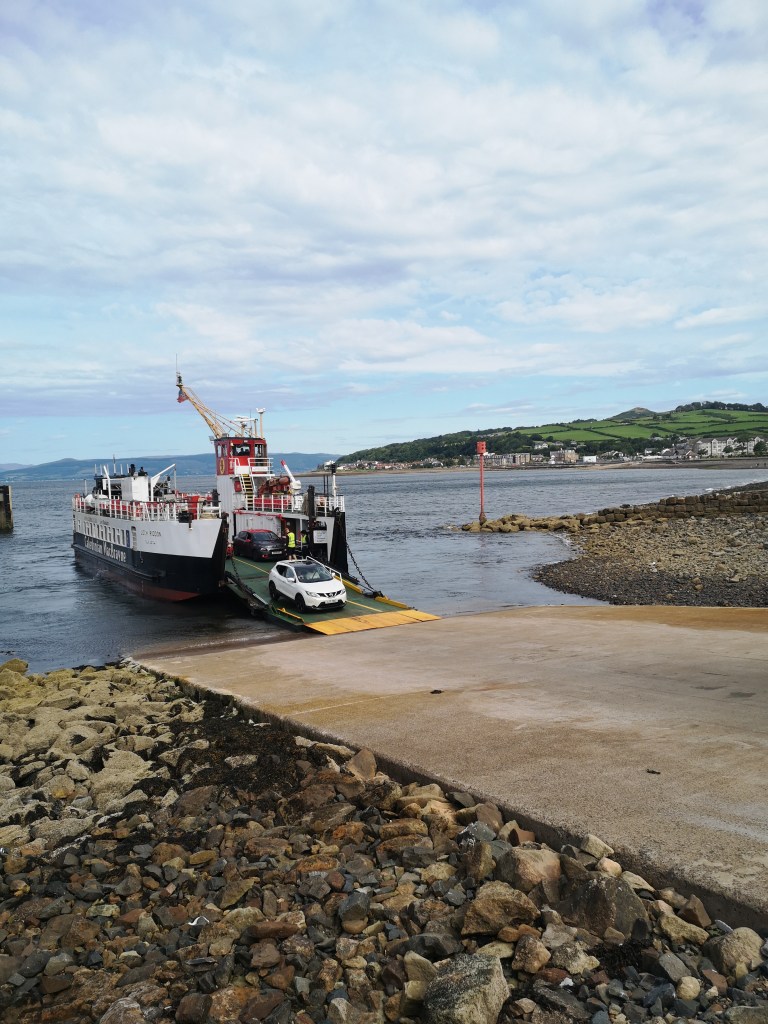 A car coming off the ferry in Largs' bay