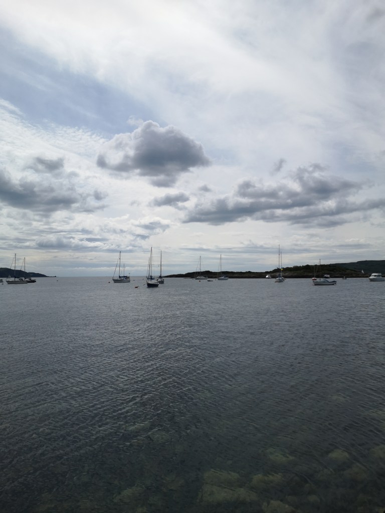 wee boats sitting out on the water