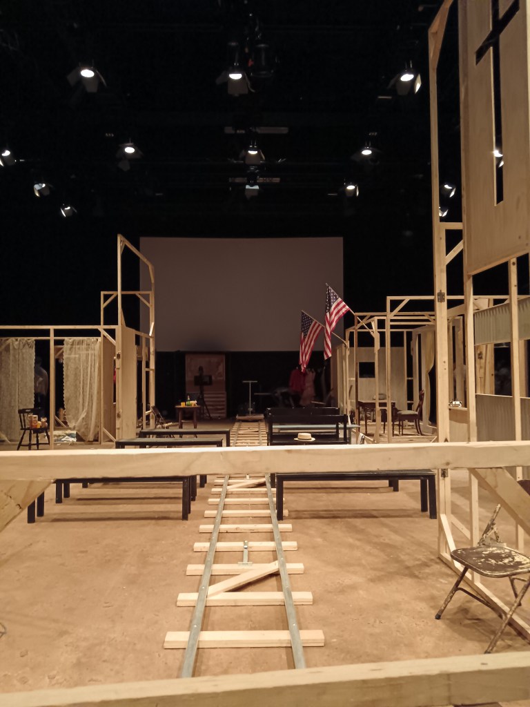 A set made of light wood frames and some American flags