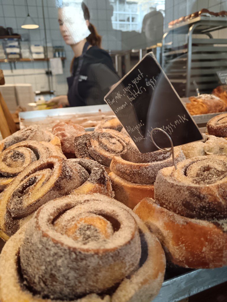 A case filled with delicious looking cinnamon buns