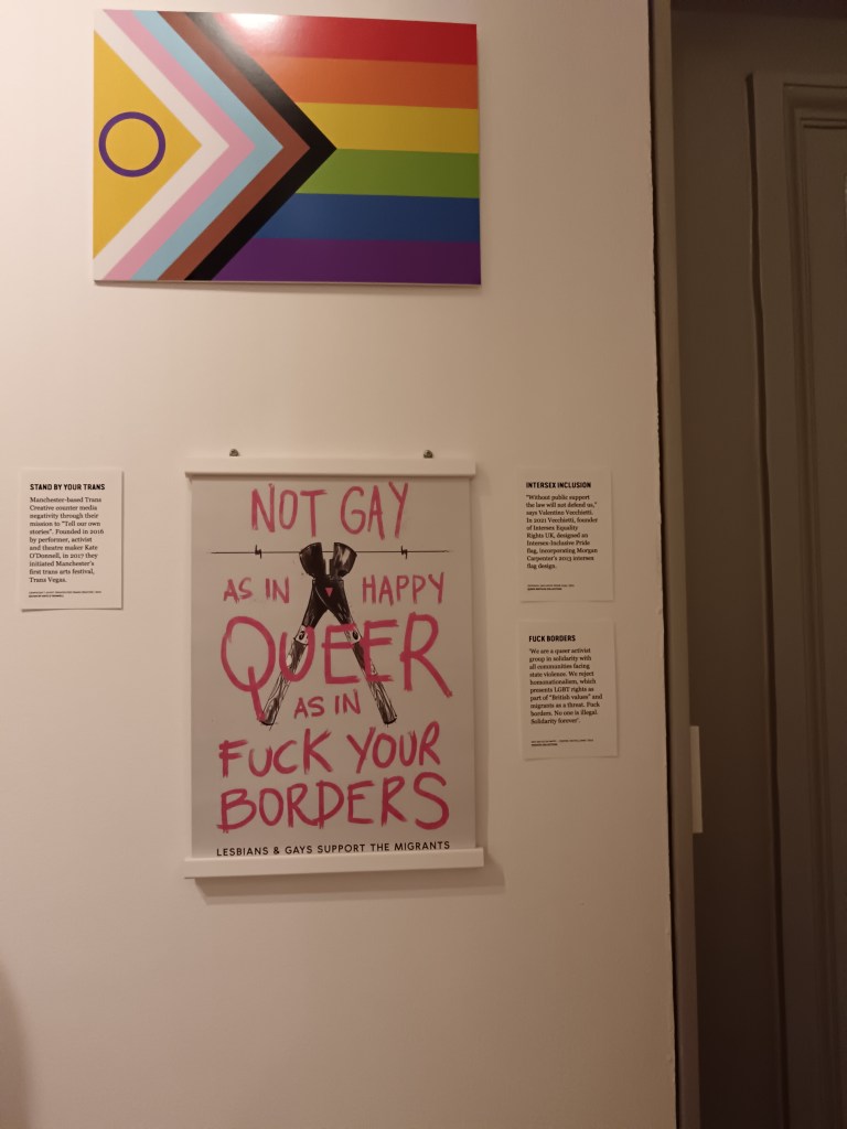 A sign that says 'Not gay as in happy, queer as in fuck your borders'