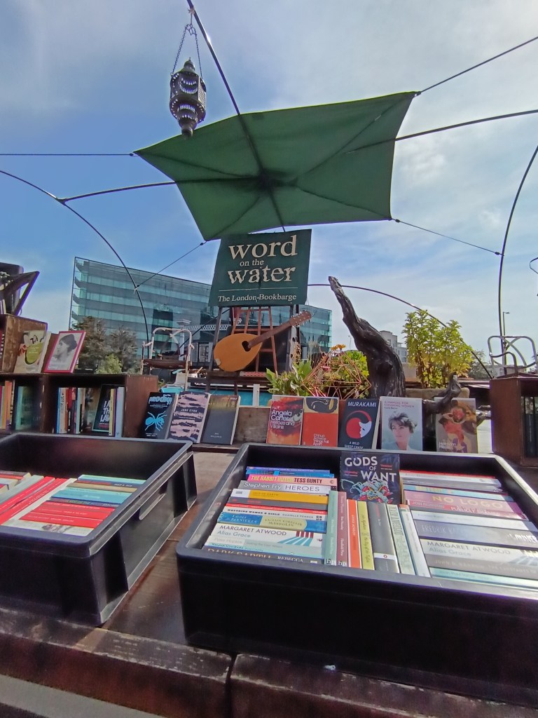 Crates of books sit on top of the book barge
