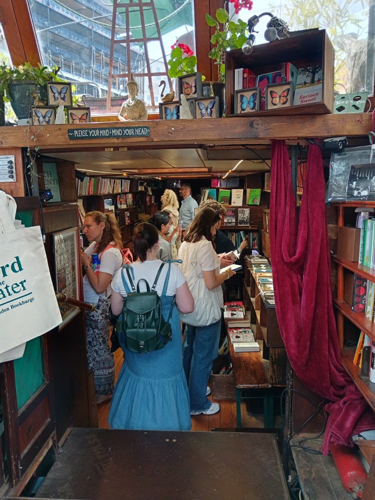 Erin walks into the wee bookshop boat
