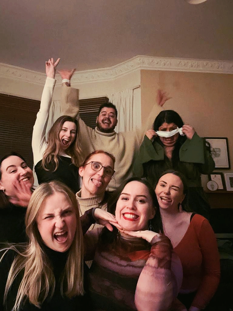 A group of pals posing with silly faces