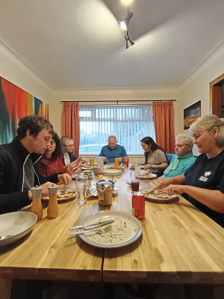 My family sits arounf the dinner table