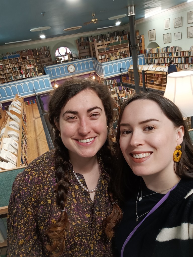 Georgia and I smile in front of a cool old bookshop