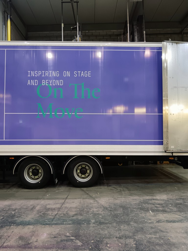 A truck that says On the move 