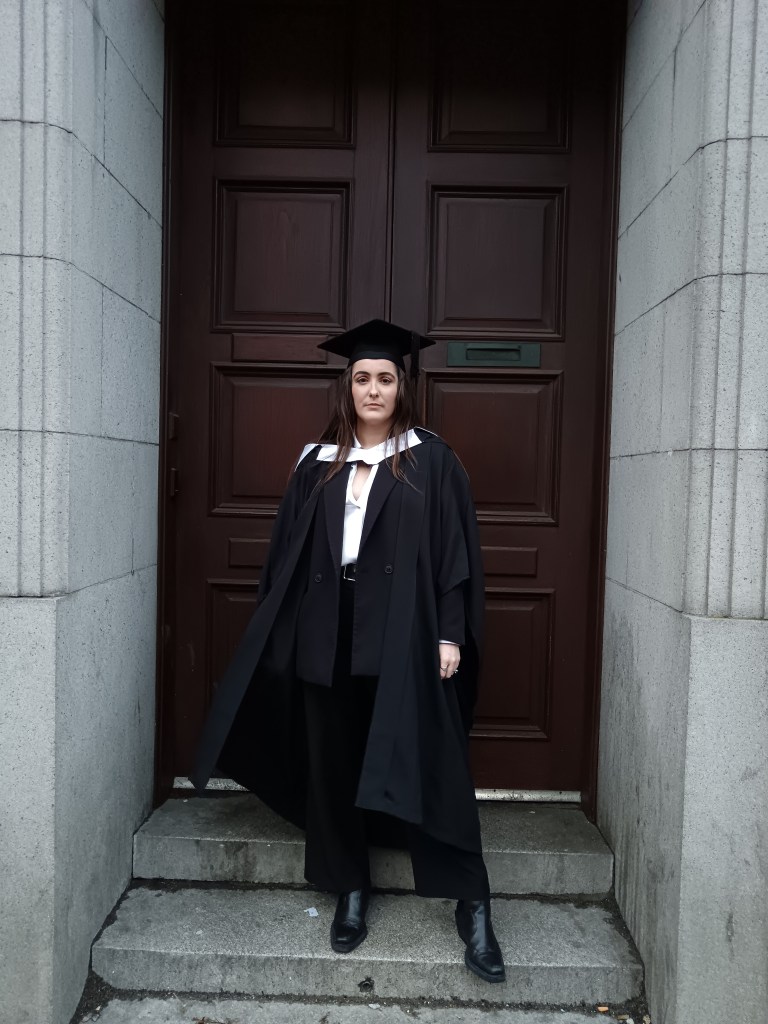 My sister in graduation cap and gown looking cool