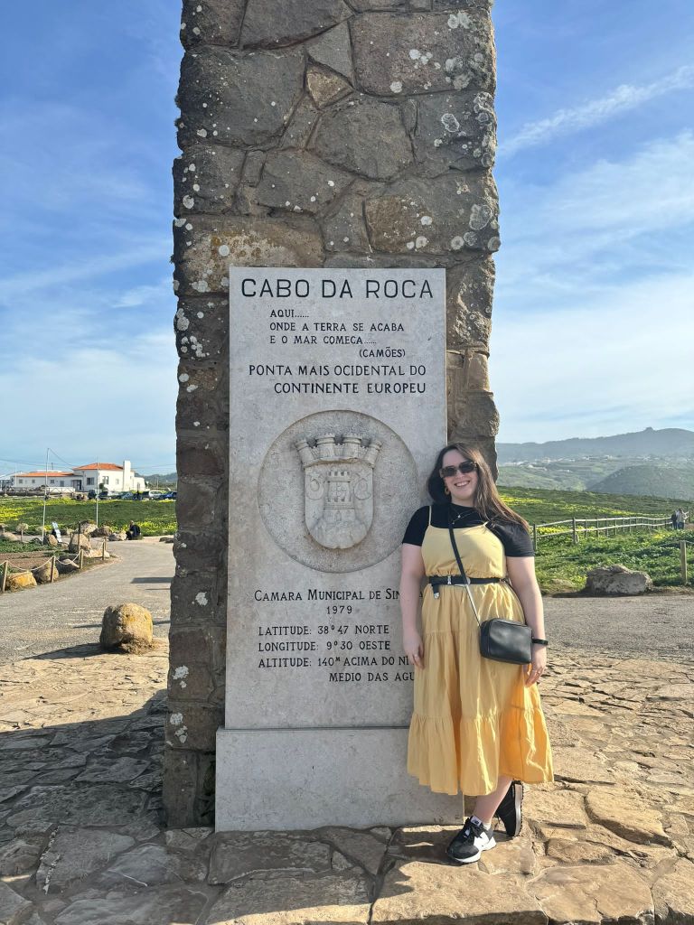 I stand beside a monument that says Cabo da Roca where the land meets the sea