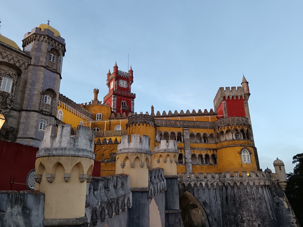 A yellow and red castle of turrets