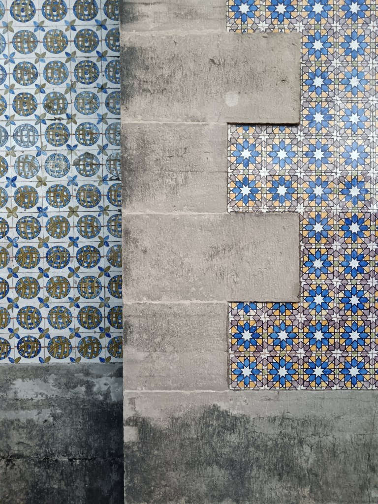 A wall with two different types of patterned tile
