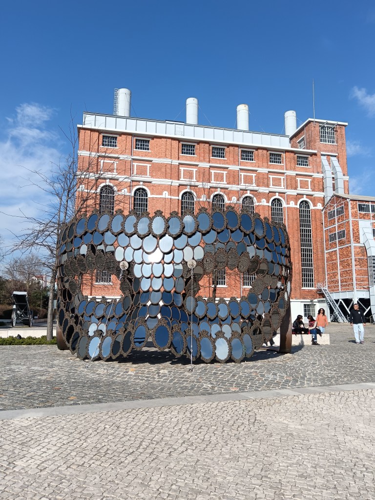 A masquerade mask art piece made up of old mirrors