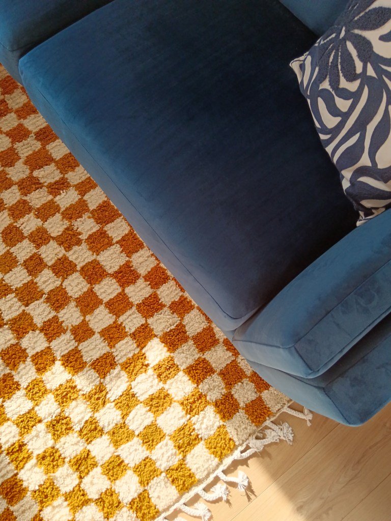 Overhead shot of my rug and sofa