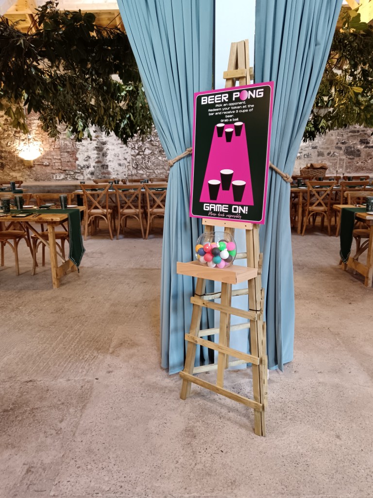 Beer pong sign and balls