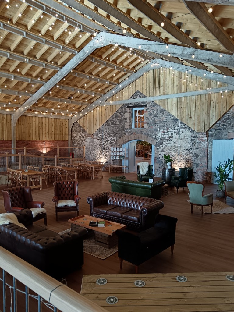 Loads of sofas and seating areas in a barn