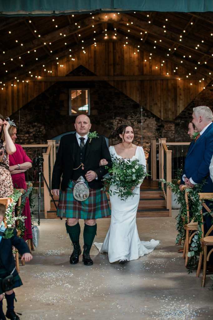 My dad walks my sister down the aisle