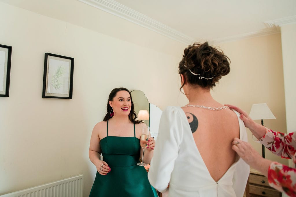 I smile at my sister the bride