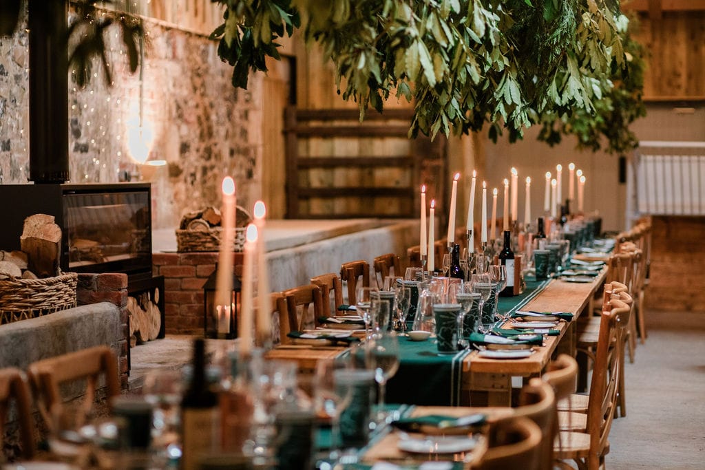 Row of dinner tables with candles lined up