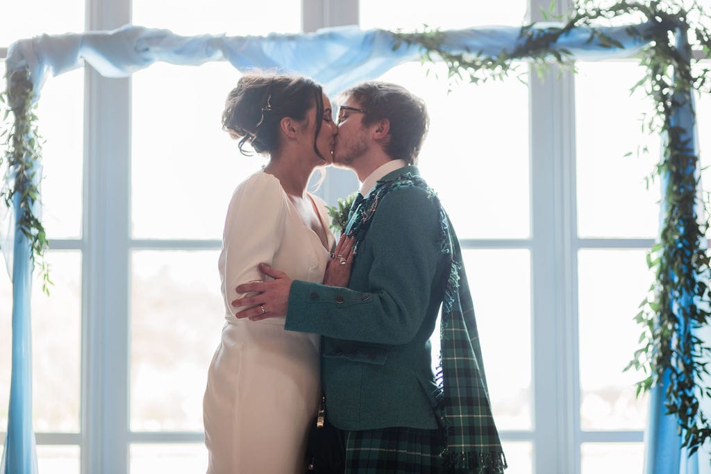 Bride and groom kiss