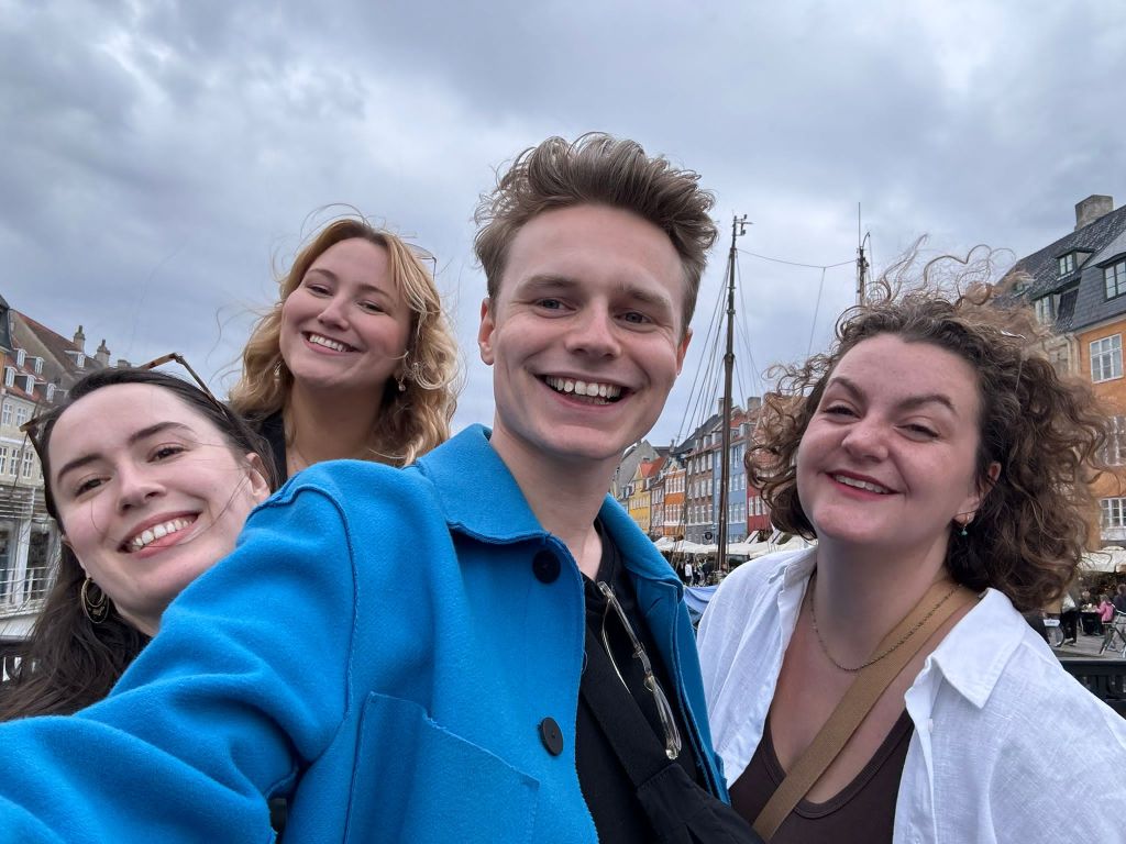 All four of us smile for a selfie