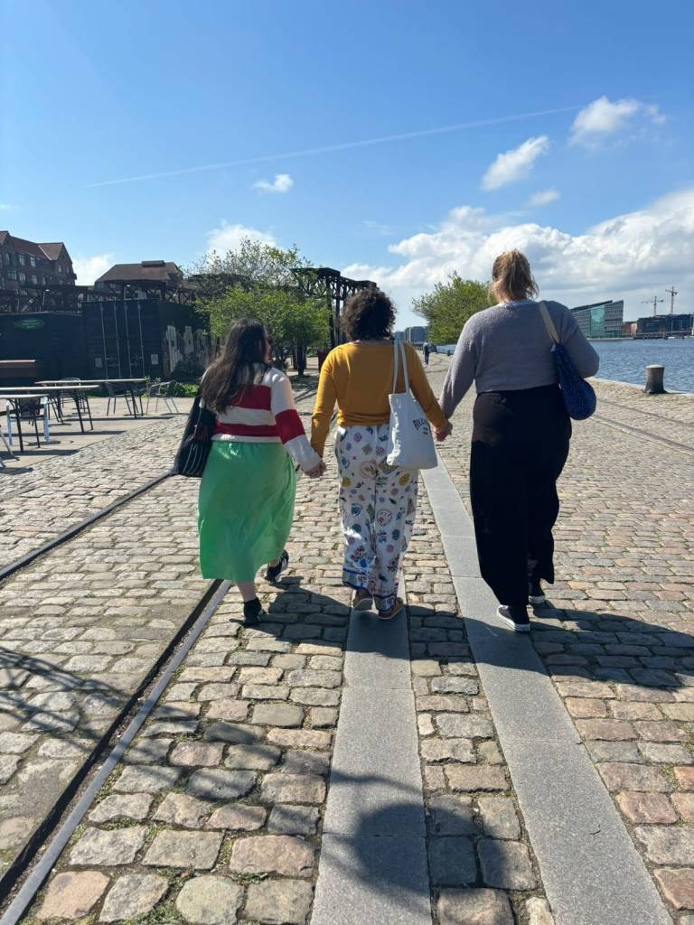 Laura, Hanna and I hold hands as we walk