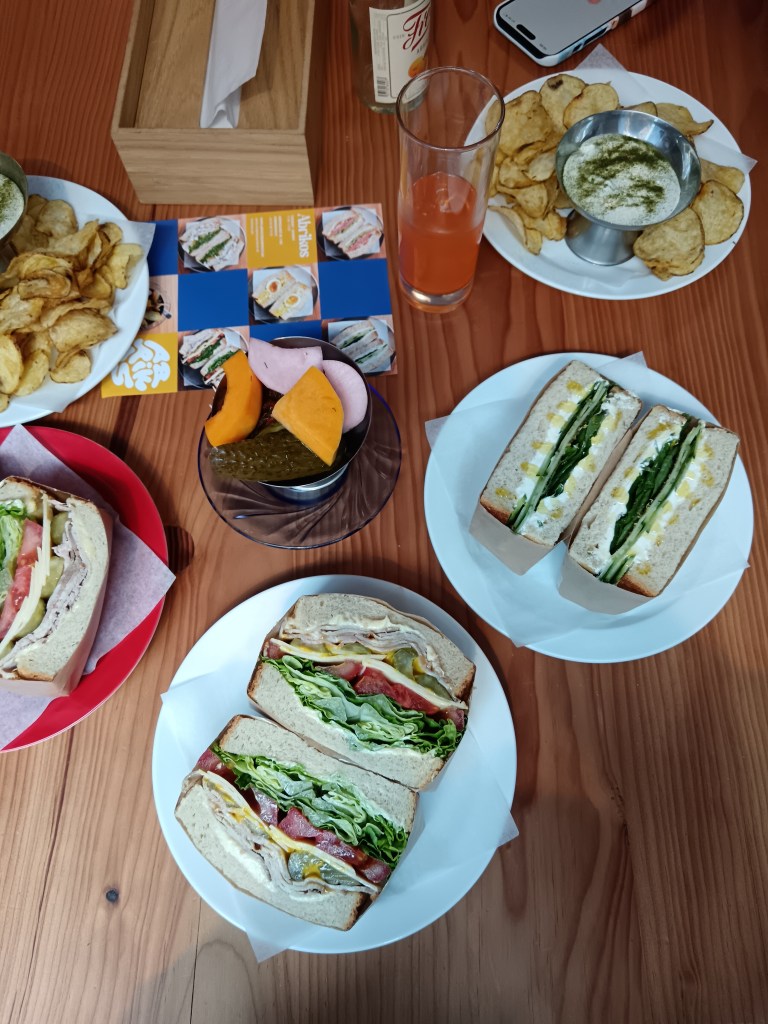 Sandwiches and crisps on a table