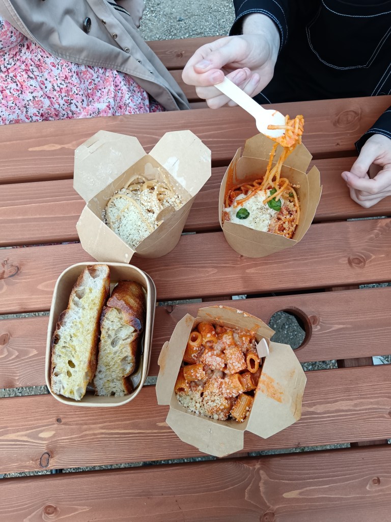 Take out boxes of pasta and foccacia