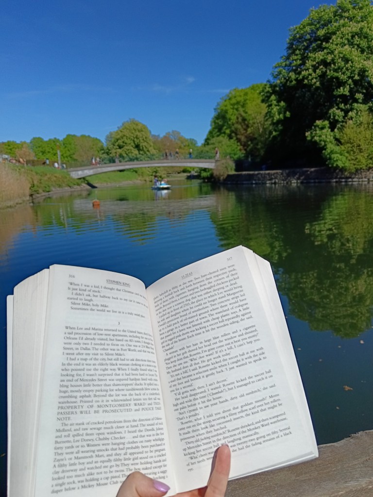 An open book beside a river