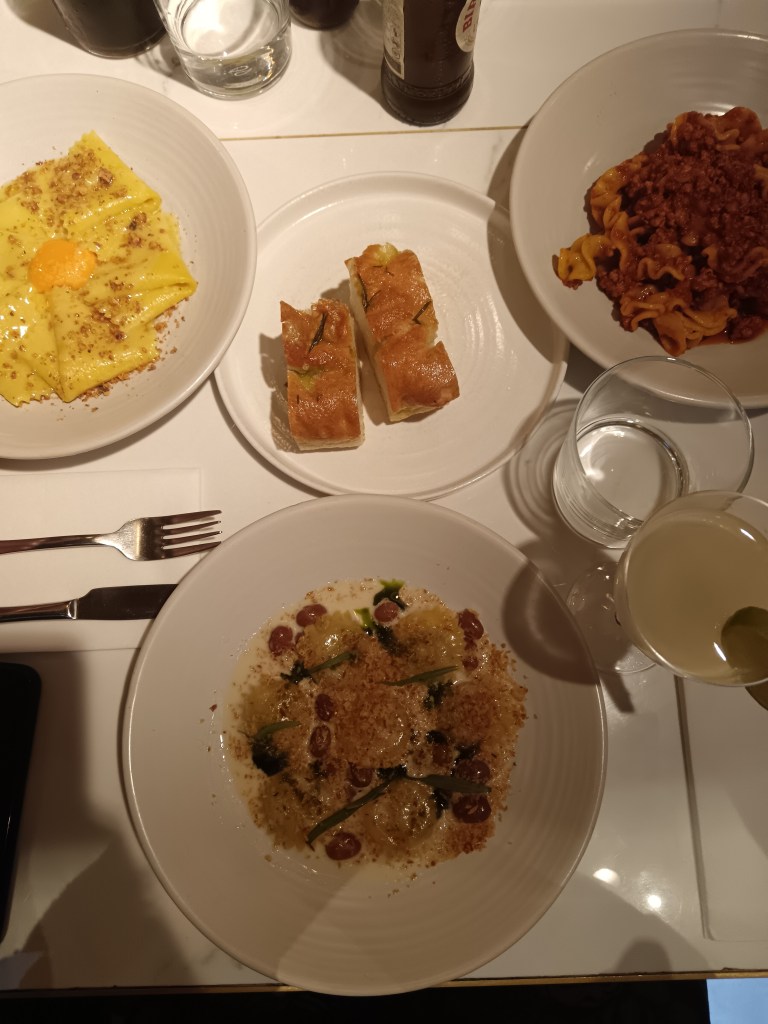 Plates of pasta with foccacia