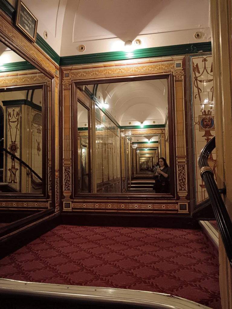 I take a picture in a mirror facing a mirror that goes on forever