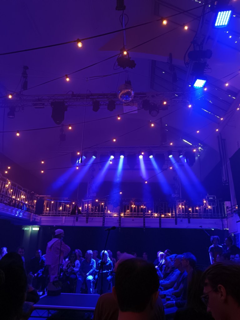 A room surrounded by blue and fairy lights