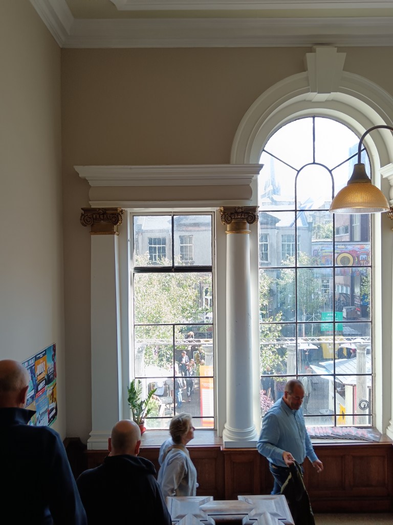 A big bright window framed by pillars